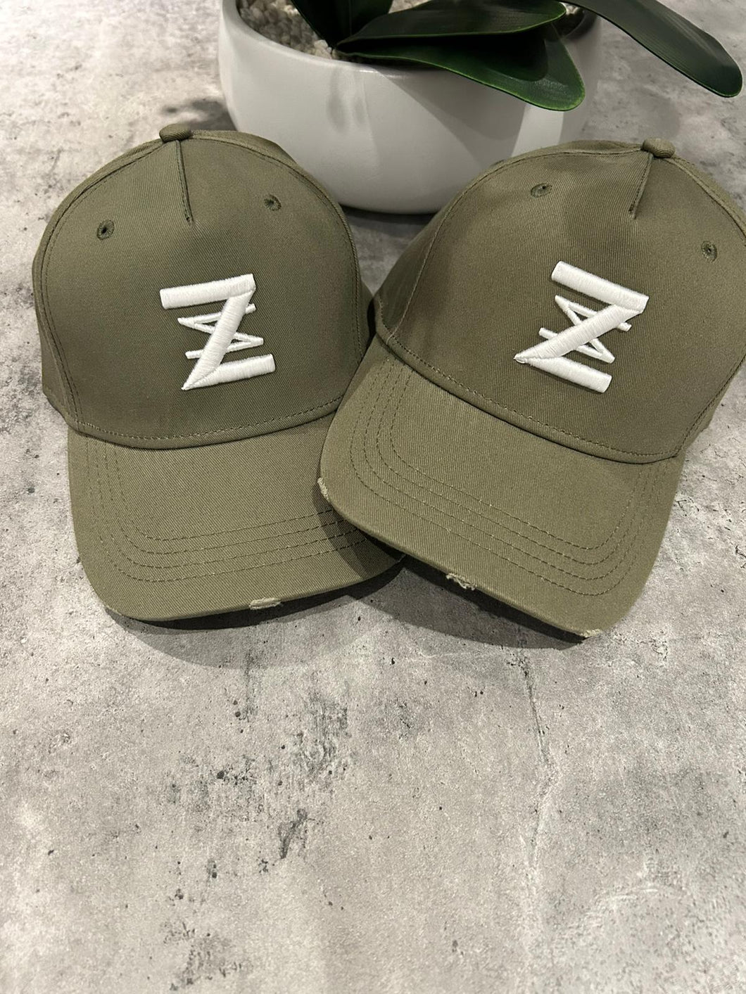 Khaki distressed logo cap.
